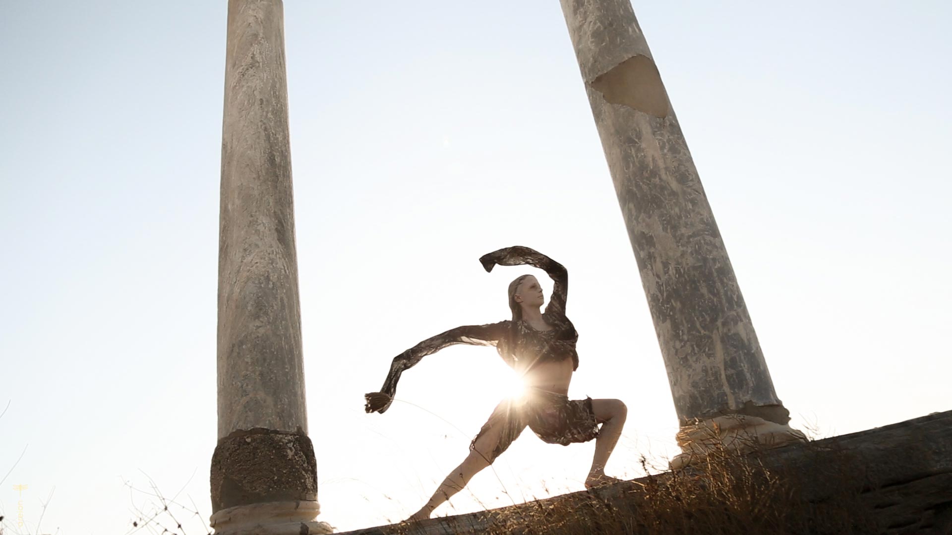 Olia dancing among the ruins of the Delos during the Anamnesis performance.